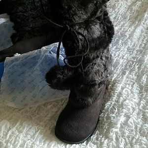 Faux fur calf high boots.